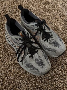 ASICS Men’s Gray Athletic Running Shoes with Black and Orange Accents